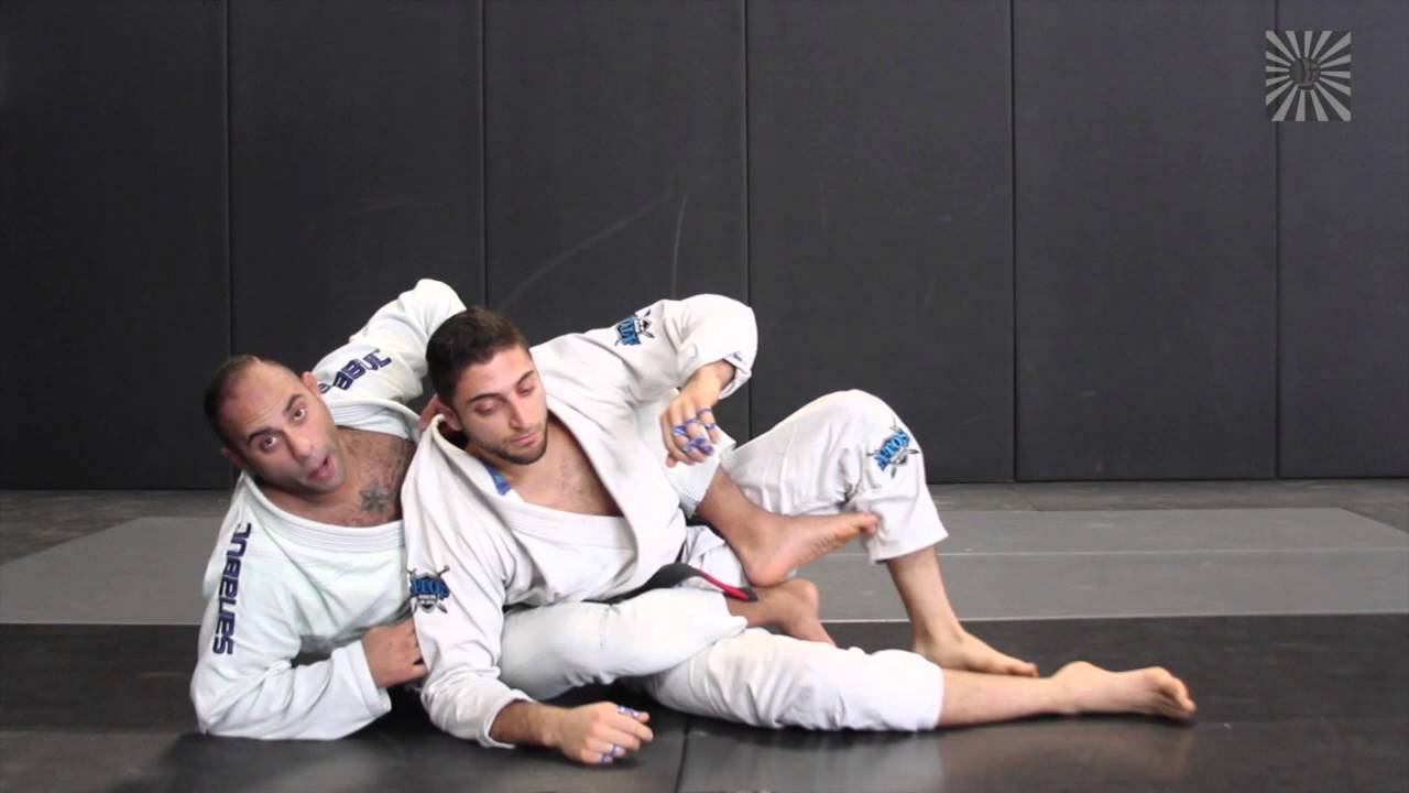Black Belt Ahmed Zaki shows transition to Back from half guard