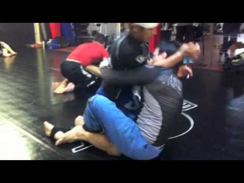 Eddie rolls with Hideo Tokoro